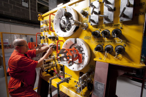 Technician working on subsea controls system